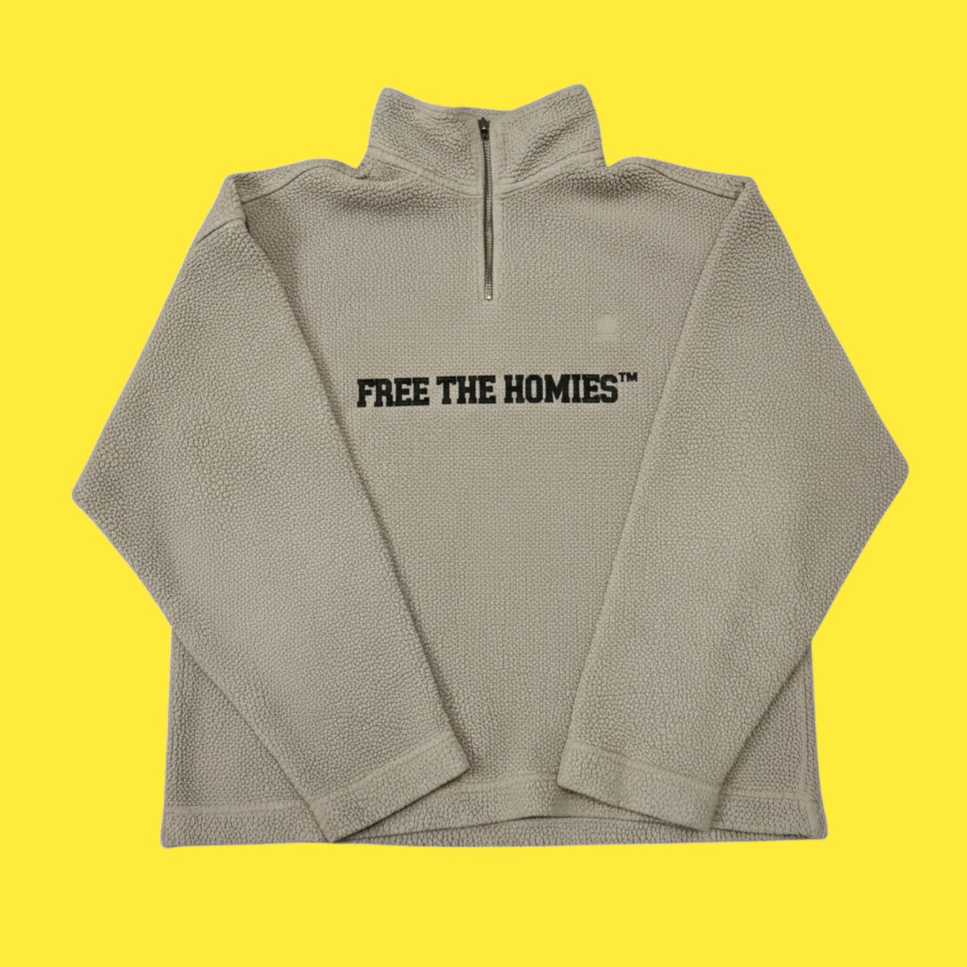 FTH x Tommy Hilfiger Rework Fleece 1/1 — beige sherpa half-zip with black FREE THE HOMIES™ embroidery, upcycled vintage streetwear piece.