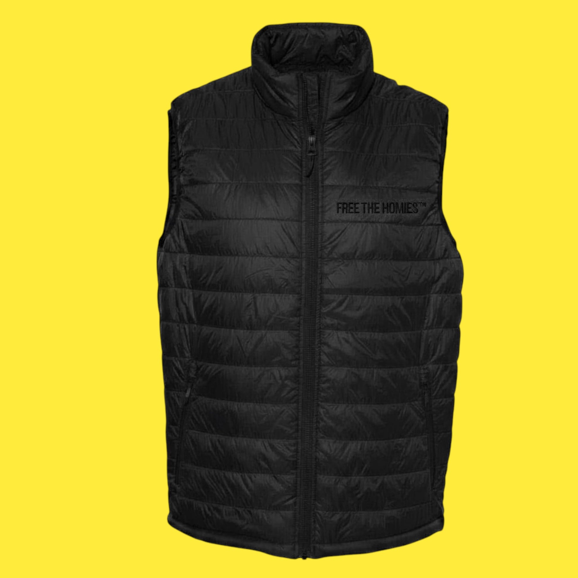 Black puffer vest with 'Free the Home' text on a yellow background